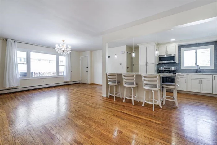 Under 10 min walk to Journal Square path and also steps from Downtown Jersey City, this home has it all. Fully updated Kitchen and bath, Gleaming hardwood flooring, upgraded lighting, Washer/Dryer IN UNIT & Parking in the driveway. The home is Clean and organized with a great layout, large room sizes and good closet space. Call now for more info or to schedule a private showing.