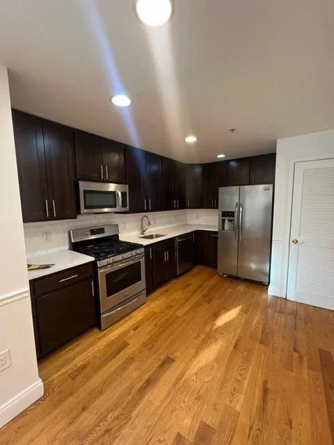Beautiful 2BR 2BTH located right off of Palisade Ave in West Hoboken section of Union City. Steps from bus stop, and only a 15 minute commute to midtown Manhattan!!! You prefer the light rail? The building is a short 10 minute walk to 9th St Light Rail Station. The unit features an open layout with hardwood floors throughout, modern kitchen with quartz countertops, subway tile backsplash, and stainless steel appliances, large LR/DR, Master BR w/ granite/marble Master BTH, 2nd BR and full bath that also features granite/marble tile and jet tub, as well as a stackable washer/dryer in unit!!! Elevator Pet Friendly Building with 1 car assigned garage parking included. FLOORS HAVE BEEN SANDED AND STAINED after pictures were taken.