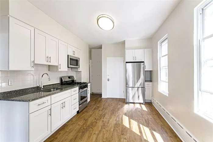This gorgeous, contemporary 1 Bed + Den apartment is located on a quiet street on the western slope of the Jersey City Heights. The home features a clean contemporary aesthetic with windows in every room that let in plenty of light no matter what time of day. The unit is fully renovated and well appointed with stainless appliances & hardwood floors. The eat in kitchen features brand new cabinets, quartz countertops & brand new appliances. It is perfect for the whole family to crowd around! Located just one block from Kennedy Blvd for easy access to the buses that run every few minutes to the Journal Square transportation hub. HEAT AND HOT WATER IS INCLUDED making this an extremely affordable option!