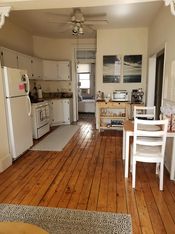 Large, bright one bedroom plus den with open layout. Eat in kitchen, exposed brick, hardwood floors, decorative mantle. Washer/dryer in unit. Heat, hot water included. Near shopping, Bus to NYC and PATH.