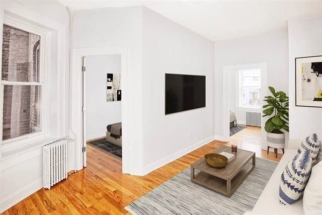 This recently gut renovated 2 bedroom walkable to the GROVE PATH train features stainless steel appliances, hardwood floors, and great natural lighting, and laundry room on site. This unit works well for roommates or small family with similar sized rooms. Heat and hot water included. Available now!