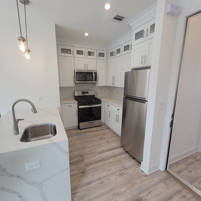 Luxuriously renovated 2bd/1bth apartment close to all major connections to NYC or RT 3 and Turnpike. Features open kitchen layout with full stainless steel appliances & w/ dishwasher, recessed LED lighting through out, large windows and an integrated remote fireplace in the living area. Separate utilities, one point five months security and one month broker fee due at lease signing. First month due before move in. Appliacants MUST present verifiable income & credit info. Call today!!