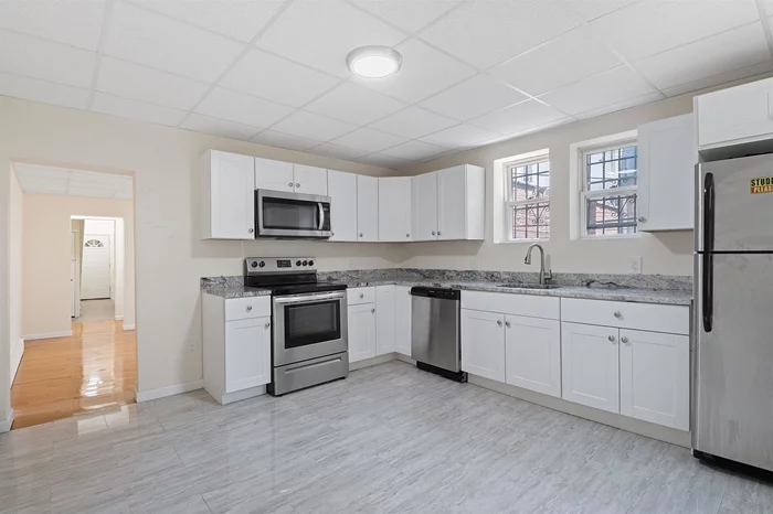 Welcome all to this custom unit in the heart of Jersey City's beautiful Historic downtown area. Only 2 blocks from the Grove Street Path station and into NYC in minutes. This is a Manhattan commuter's dream come true. This apartment features a private backyard, 1 bedroom, 1 large den, living room, and kitchen giving you everything you need. An amazing location for the social butterfly as well as the introvert. Beautiful neighborhood and just around the corner from Jersey City's well-known pedestrian plaza as well as many of the city's finest restaurants, local shopping needs, and much more!