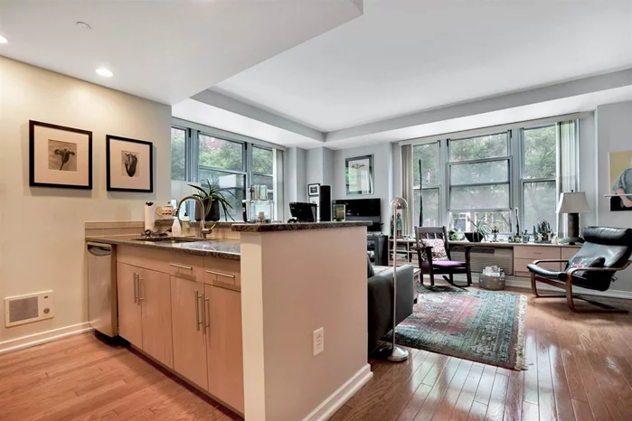 Welcome home to this 2 Bed / 2 Full Bath, corner unit, located on a tree-lined street in the heart of Paulus Hook, the most desirable neighborhood in downtown Jersey City! In the prestigious Fulton's Landing building, this 968 sqft, split bedroom floor plan has an open layout and will be sure to please featuring hardwood floors throughout and an abundance of windows to allow sunlight in all day long. Featuring a chef's kitchen with stone countertops, custom kitchen cabinets, stainless steel appliances, and breakfast bar that opens to the living and dining room. Master ensuite, generous sized second bedroom, and full bathroom finish off the home. An in-home W/D and one car parking included. Fulton's Landing features a 24-hour doorman, landscaped common courtyard, reception lounge, and fitness center. Short stroll to a multitude of restaurants, marina, waterfront, two PATH stations at Exchange and Grove, Citibike, Light Rail, and Ferry. Don't miss this one!