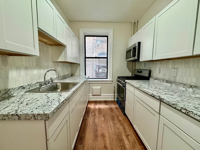 Large Updated and Renovated One Bedroom. Brand new Kitchen Cabinets and countertops. Renovated bathroom with gorgeous new tile. Great layout and lots of space. Large Living room and Bedroom. Located just a block away from NYC buses and transportation.  AVAILABLE FOR JULY 1ST  Schedule a viewing today!