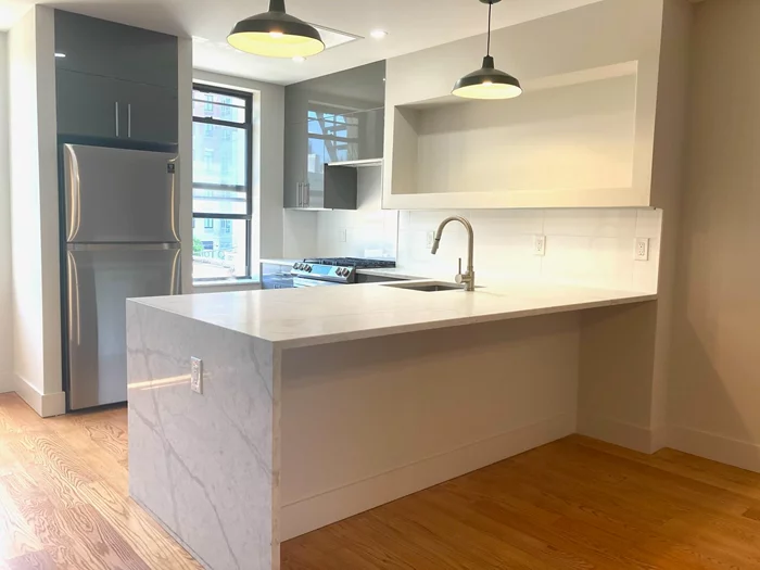 Newly renovated 1 br. in Paulus Hook that must be seen to be believed. Every detail has been thoughtfully and beautifully finished in this new home starting with a full size kitchen with all new stainless steel appliances, plenty of cabinets and a 4' x 8' countertop that can seat three comfortably. A spacious living area connects to a huge 10' x 20' bedroom with three north facing windows for beautiful morning light, two closets and the original fireplace in this 19th century brownstone. The tiled bathroom boasts a full body shower system, modern fixtures and a washer/dryer neatly tucked behind the door. This is a dream apartment ideally located near two PATH stations in the heart of Downtown JC--don't miss it!