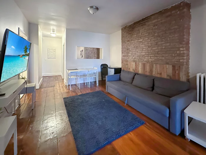 Large 2 bed, 1 bath offering 1000 sq ft in a prime location on Washington Street in the heart of Hoboken! Featuring exposed brick, updated kitchen with stainless steel appliances, updated bath and refinished hardwood floors. WASHER/DRYER in unit. FULLY FURNISHED, perfect for students. Can serve as a flex 3 bd as current tenants use oversize master bed closet as a 3rd living quarter. Only four blocks from path station. Plenty of natural light. Bedroom has large walk-in closet (currently used as 3rd bedroom). Available June 22, 2024 - possibly sooner.