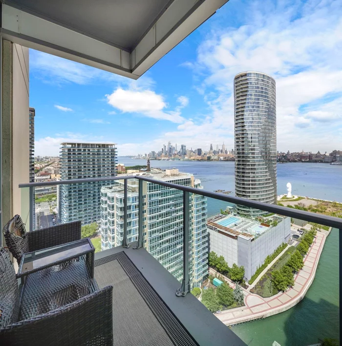 Come live in the sky in this rare-to-find 2bd/2ba/1335sqft corner unit in JC's most prestigious complex in the Shore North! Upon entrance, you'll be taken away by the unparalleled panoramic views of the majestic Hudson River, stretching from the iconic George Washington Bridge all the way to the Verrazzano-Narrows Bridge. The spacious layout of this home seamlessly blends modern design with functionality, offering an ideal space for both relaxation and entertainment. Chef's kitchen features top of the line appliances, 24-inch custom tiles, marble granite countertops, and a lavish diamond-cut backsplash. In the living and dining rooms you will be surrounded with floor-to-ceiling windows, which flood the space with natural light and grant access to once-in-a-lifetime views of NYC. Around the corner, you can indulge in a spacious master bedroom with direct views of the Empire State Building. With hardwood flooring throughout, access to a private balcony, and 1335 square feet of living space, this home is too good to pass up. Amenities include a sky lounge, Jacuzzi, sauna & steam room, private gym, kids' playroom, game room and conference room. Come schedule a showing!