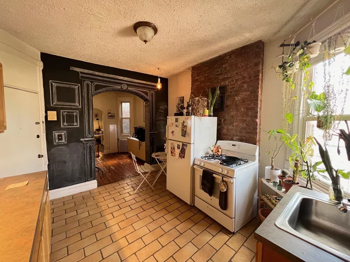 Spacious railroad style unit featuring original wide plank hardwood floors. Large bedroom with fire place mantle. Conveniently located in the heart of downtown, just a few blocks to Van Vorst park, the Grove St PATH, and lively Newark Ave pedestrian plaza. Heat included in rent!