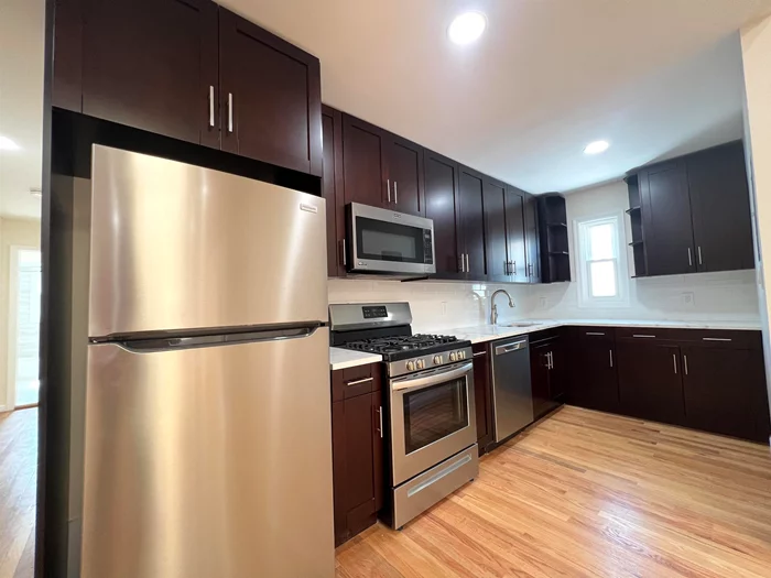 Completely renovated 3BR/1BA in JSQ! Bright & spacious unit located on the top floor with large patio off the living room. Brand new kitchen and baths, redone hardwood floors throughout, and plenty of closets/storage. Bedrooms are all an excellent size. Washer/dryer hook-ups in unit. No pets permitted. Centrally located in the Marion Section of Journal Square within mere few blocks to PATH station, Available 8/1