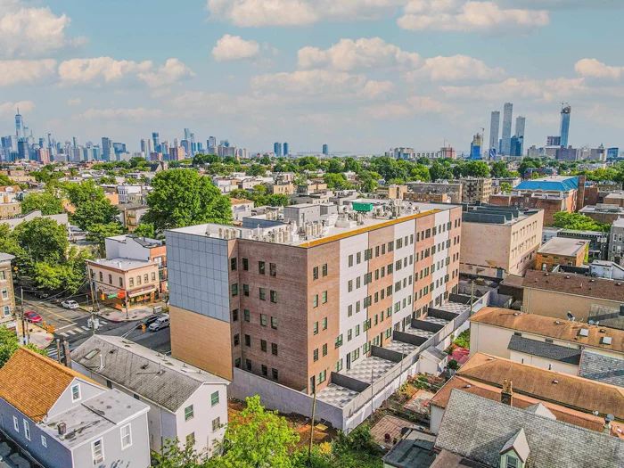 Experience the epitome of modern living in Hudson Heights, where the landlord covers the broker fee for added convenience. These pet-friendly, new construction residences exude sophistication and comfort, complemented by an array of exceptional amenities including a doorman, package room, elevator, and soon-to-be-unveiled fitness center. Take in breathtaking views of New York City on three communal roof decks featuring grills and fire pits. Unit 307 showcases an inviting open living concept with 2 bedrooms and 1 bath. The kitchen is a focal point, boasting a contemporary designer look with quartz countertops, Samsung stainless steel appliances, and a stylish tile backsplash. Additionally, the unit comes equipped with a brand new stackable washer & dryer, while garage parking is available for an additional fee. This prime location offers easy access to NYC commute options such as the PATH and bus, with parks and schools just a stone's throw away.