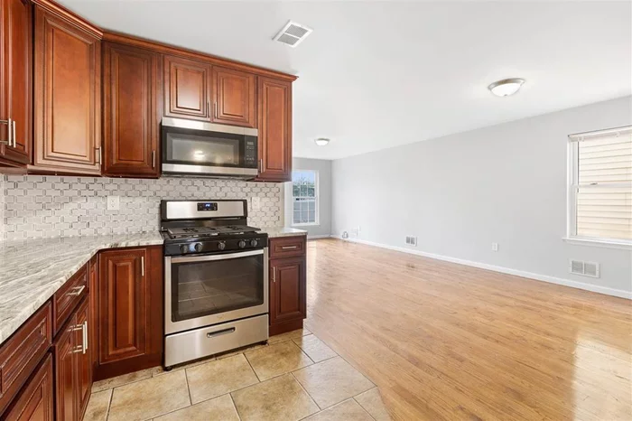 Beautiful and spacious 3 bedroom 2 bath feature large living space, a fully equipped kitchen with a granite countertop and stainless steel appliances, and beautiful hardwood floors throughout. Washer/drier and central air/heat. Great Location, 1 Block To Kennedy Blvd, Bus To Journal Square PATH!