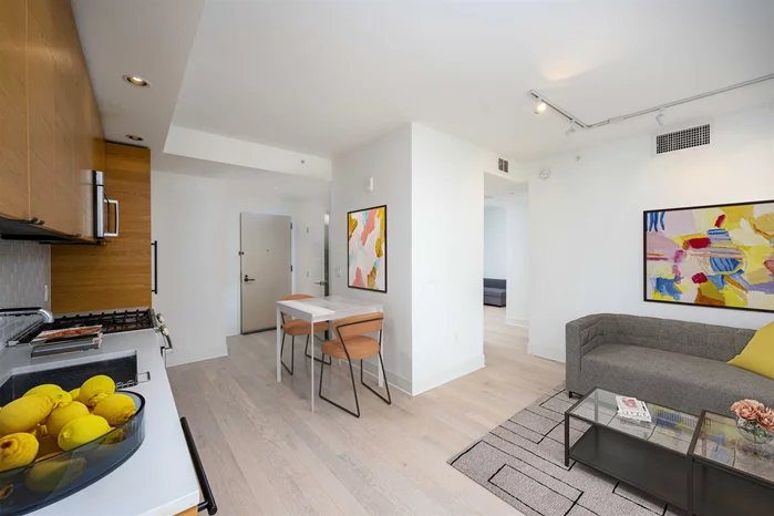 Located in the preeminent luxury building in downtown Jersey City, unit 1105 is going to be the home that you call HOME. This oversized one plus den is often used as a two bedroom. The primary bedroom features an in suite bathroom, while a powder room (half bath) is available in case company comes over. And company is definitely going to want to come over when they find out you live in this amazing home in this AMAZING building. The unit features full size washer and vented dryer. It is south facing so you'll love letting the sun shine in. Since this is a Toll Brothers Building, everything is high end. The massive Thermador Fridge will hold all the groceries you collect from Whole Foods, BJs, Shop-Rite, Sprove, or the Local Farmers Market at Grove St. The 5 Burner Bosch Stove makes sure that all that food in the fridge can be cooked to immaculate perfection. Do not stress the dishes afterwards, because this THREE rack Bosch dishwasher is ready to make your dish cleaning effortless. Once settled in, you will never want to leave home. However, with 27, 000 square feet of amenities for only 242 units, this boutique building has more than enough reasons to keep you here, even if you step away from your dream home. Whether on the roof deck with panoramic views from the North, to the East and South, or one floor down in the Sky Lounge. There is always a view to be had. Whether engrossed in conversation with your amazing community of neighbors, or flying solo and just taking it all in, nirvana is found at the top of 10 Provost. Feel like getting active, the 7th floor has a kids play area, a gym, a pool, gas grills, a meeting room, a party room, a ping pong table, and it just keeps going on and on! Yes friends, whomever said you can't have it all, definitely never visited 10 Provost, but you can. Make your appointment today! Available Now. Available Early Sept.