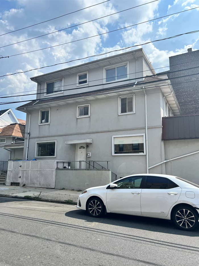 Just a one block walk from St. Peters College. Freshly painted with newly finished hardwood floors. All HUGE rooms. 2 full baths, one with jacuzzi. All new ss kitchen appliances in eat in kitchen. W/D in Basement. Walking distance to Path, shopping and parks.