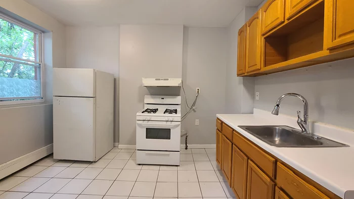 This spacious three-bedroom, one-and-a-half-bathroom apartment at 40 Martin Luther King Drive in Jersey City's Greenville neighborhood is now available for rent. Featuring beautiful floors and updated appliances, the unit also boasts tile flooring in the kitchen and has been freshly painted, offering a bright and inviting atmosphere. Residents can enjoy the convenience of free street parking, additionally, a laundromat is conveniently located just around the corner, making this apartment both practical and inviting. Move-in ready as soon as possible.