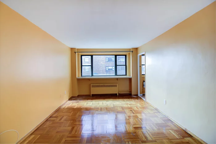 Bright & Airy, freshly painted spacious one bedroom with partial NYC views. Updated kitchen & hardwood floors throughout. Rent includes heat, hot water, & cooking gas. Electric (paid by tenant) is sub-metered (low bill). Building features doorman, laundry room & gym. 24 hour transportation to NYC right in front of building. Close to shopping, places of worship, schools and parks.