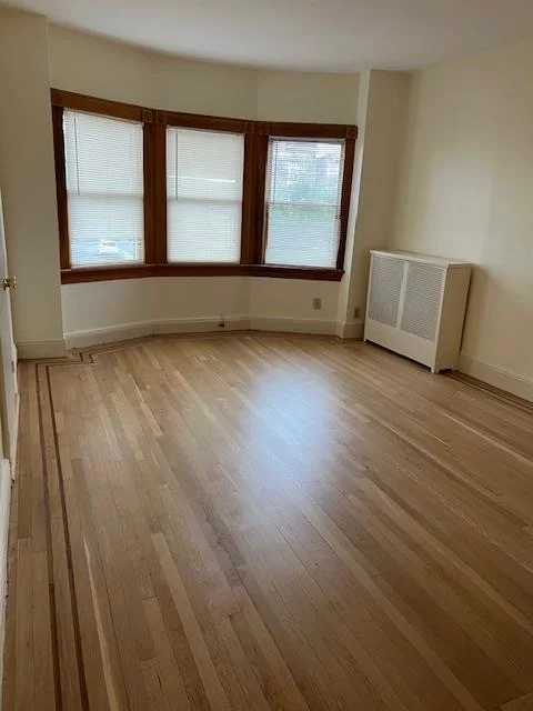 Over sized top floor apartment of quiet two family home on desirable Ogden Ave. Just refinished hardwood floors, large newly renovated eat in kitchen with dishwasher, new cabinets and new flooring. Heat included in rent. Free washer/dryer downstairs. Easy short walk to light rail elevator. 2 window a/c units provided. Sorry no pets.