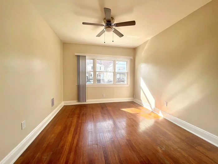 RARE two bedroom apartment available in the highly desired Bergen Point section of Bayonne! Featuring two spacious bedrooms, fully renovated bathroom, tons of natural sunlight, hardwood floors throughout, an eat-in- kitchen, and more! Enjoy the bonus amenities being offered such as the off street/ PRIVATE parking space for 1-2 cars, washer & dryer access, and use of the backyard! Within walking distance to the lovely first street park, 8th street light rail, and plenty of shops, restaurants and more! Inquire today to set up your private viewing!