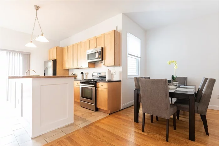 Beautiful, sun-drenched 3-bedroom, 2-bath duplex with private yard overlooking NYC skyline! This unit features an eat-in kitchen with an island, washer and dryer, hardwood floors, central AC and heat, and high ceilings. Located near public transportation to NYC and a light rail station.