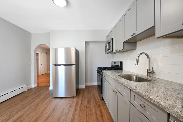 Welcome Home to this Stunning 3 Bedroom, 2 Bathrooms Apartment on the 1St Floor and Ground Floor, located in the heart of Jersey City, Journal Square! Apartment rent includes All Utilities, and Pets are Allowed. A Washer/Dryer is in the Apartment! It is located in a highly desirable neighborhood on a quiet dead-end street in McKinley Square just minutes away from local shops, restaurants, and entertainment. This Apartment has been Beautifully Renovated with High End Finishes including Stainless Steel Appliances, Granite Countertops and Hardwood Floors. For your Convenience the Bathrooms have Dual Sinks. The Apartment comes with a Large Backyard exclusively for your use and Perfect for Entertaining. The Location has Easy access to major highways and public transportation and Minutes to New York City through Journal Square Path Trains, Light Rail to Hoboken and Buses.  Make an Appointment Now to see this Apartment as it Won't Last! 2 Year Lease Preferred and Background check and Proof of Income is Required by Landlord.