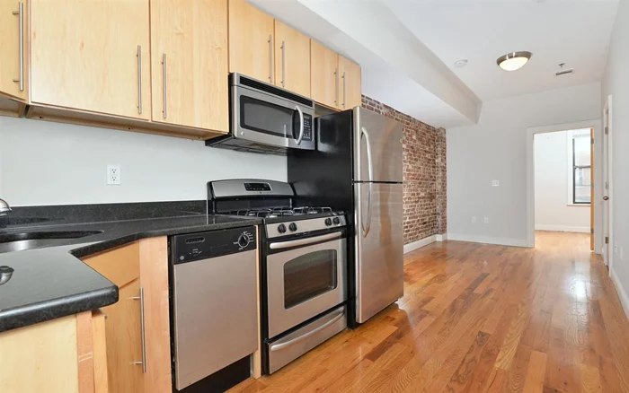 AVAIL DEC 1 - Pet Friendly! Great 2 Bed / 1 Bath unit at Monroe Flats building in Prime Location with spacious terrace overlooking the backyard. Unit features are Central A/C, Forced Hot Air, Hardwood Floors, Dishwasher, Washer/Dryer in unit, and beautifully exposed brick. Spacious Terrace, spacious bedrooms, ample closets. Conveniently located near NYC transportation, nightlife, shopping, and parks. Shared Backyard. *Pictures of similar unit* Advertised rent is net effective on last month of rent FREE on a 12 Month Lease. Gross Monthly Rent is $3250.