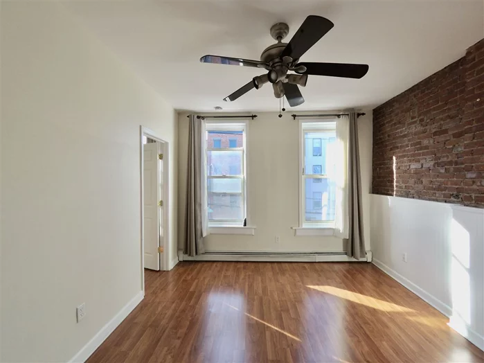 Prime location in midtown Hoboken. Spacious 980 sqft 2 beds/1 full bath condo for rent. Sunny bedrooms, one with a walk-in closet. Wood flooring throughout. Large living room and dining room. Upgraded modern kitchen with stainless steel appliances. Full bath with updated vanity and tub. Laundry room has new washer and dryer and storage space. Oversized private terrace, great for relaxing, entertaining guests and BBQ. Water is paid by landlord. Easy commute to Manhattan. Close to all transportation!