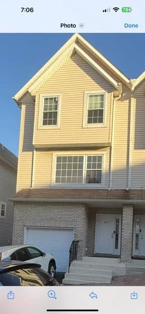 Beautiful 3 bedroom townhouse with balcony central air conditioning and finished basement with garage parking for one car and additional outside parking .