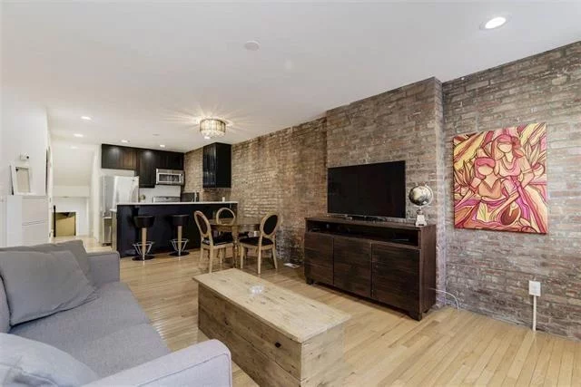 Unbeatable location, in the heart of downtown Jersey City. 5 blocks to Newark Ave's restaurant row & nightlife, 4 blocks to the Grove St. Path station, and 3 blocks from Marin Blvd light rail. This spacious one bedroom apartment is equipped with a massage tub, large private outdoor space, a work area with an additional Murphy bed, hardwood flooring throughout, and exposed brick in the kitchen & living room. The apartment also features modern amenities such as central air, washer/dryer in unit, and a pet-friendly policy, ensuring a luxurious living experience. Contact us to request a video walkthrough of the apartment.