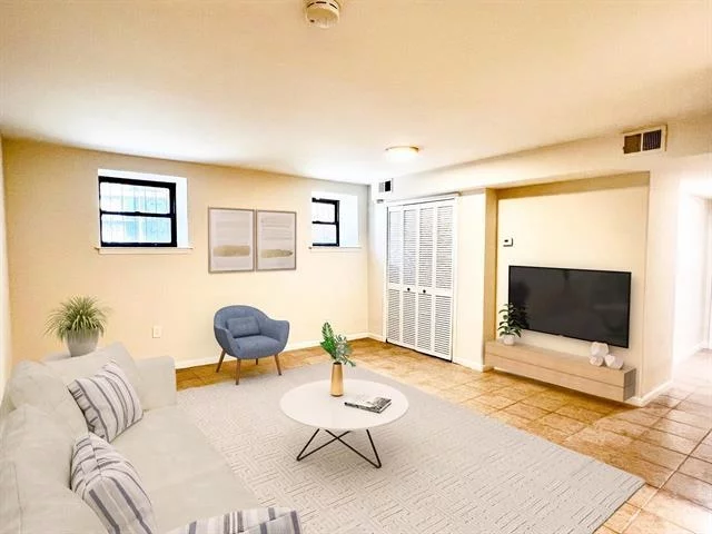 Recently renovated Jersey City Heights 1 bedroom apartment with private onsite PARKING INCLUDED! Loaded with fantastic features including a new kitchen with just installed stainless GE gas cooktop/oven, new microwave, stainless steel sink with designer faucet, quartz counters, subway tile backsplash and new flooring. The full bathroom is also completely redone with new subway tiles, flooring, vanity, medicine cabinet and lighting. This apartment also has central air and heat that will keep you comfortable all year long! Top it off with new recessed, overhead and ceiling fan lighting and there are large, full capacity washers and dryers conveniently located down the hall in your building. Your secure and gated assigned parking space with remote entry is also just mere steps away from your apartment entrance as are a full array of city amenities starting with 13.5 acre Pershing Field Park right across the street; bus to NYC at the corner; grocery stores, coffee shops and lots of delicious restaurants all up and down Central Ave. The Journal Square PATH is also nearby. Truly have it all in this ready to go, fully loaded home with parking.