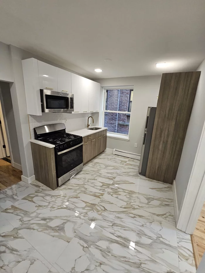 SECTION 8 WELCOME! Renovated 2 bedroom 1.5 bathroom apartment that will meet all your needs! No stairs needed come make this your home. The apartment boasts of natural lighting with luxurious accents and finishes. Kitchen is equipped with all appliances and quartz countertops