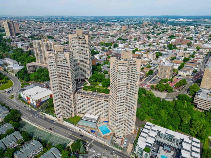 Stunning 2-bed, 2-bath condo on the 47th floor of the iconic Galaxy Towers. The open concept living and dining area creates an inviting and airy atmosphere with wall to wall windows. Step onto your private terrace, to enjoy sweeping panoramic views. Enjoy the luxury of two generously sized bedrooms, each with ample closet space and one boasting a private ensuite bath. Indulge in a resort-style experience with an array of top-notch amenities: 24-hour concierge and door staff, cardio fitness center, weight room, and exercise studio, indoor and outdoor pools, whirlpool spa, sauna, and steam room, tennis courts, private park and so much more. Convenience is at your fingertips with laundry on your floor, onsite parking available and shops on the premises. Pet lovers will be pleased to know that this community is pet-friendly. Plus, with easy access to Manhattan via the NY Waterway shuttle, ferry, NJ Transit bus, and jitneys, commuting is a breeze.