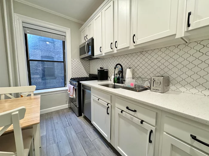 Discover this charming 700 sq. ft. 2-bedroom rental near Lincoln Park in Journal Square, Jersey City. Located in a historic, elevator building with intricate detailing, marble staircases. The unit is located on the 2nd floor and features high ceilings, an updated kitchen with modern appliances, and abundance of sunlight. Enjoy ample closet space and a comfortable layout in this unit. The building offers a washer/dryer and an on-site superintendent for your convenience. Commuting is easy with multiple bus options from the West Side. The 119 bus on the corner of JFK Blvd and Montgomery St takes your straight to Port Authority in the city, while the 80 bus offers a quick ride to the Journal Square PATH (about .75 mile distance to JSQ PATH station if you choose to walk). Embrace the comfort and the perfect blend of historic charm and modern living in this exceptional, pet-friendly rental. HEAT & HOT WATER INCLUDED