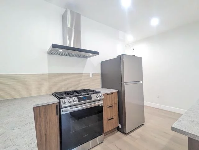 Newly renovated 2 bedroom 1 bathroom in the heart of Jersey City Heights. Ultra sleek and modern kitchen features custom cabinetry, stainless steel appliances, and backsplash. A tastefully placed breakfast island overlooks the large common space which display large windows with plenty of sunlight. Brand new hardwood flooring and remodeled bathroom with in unit washer dryer for you convenience. Live in the desirable Jersey City Heights, with NYC bus stops at your doorstep. Enjoy Riverview Fisk park with warm weather farmers markets, and great local hot spots such as Low Fidelity, Modcup Coffee, and Bread & Salt. This home is conveniently located around the corner from the 100 steps as you can walk down to the Light Rail in Hoboken within minutes.