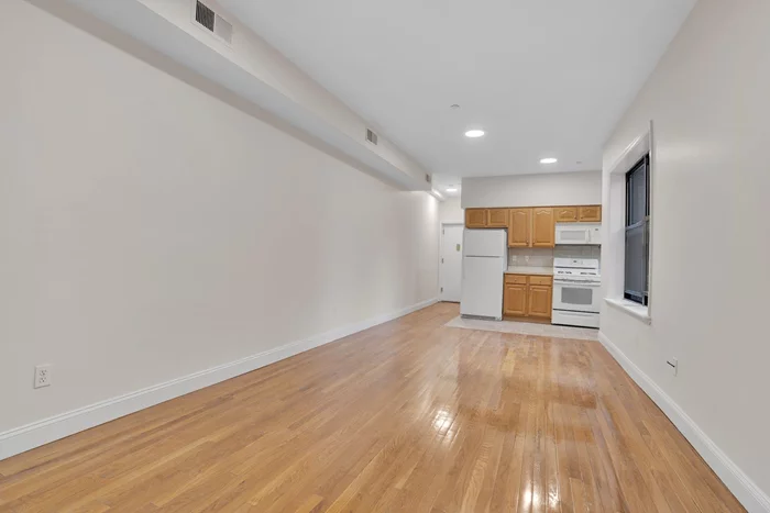 Spacious 1BR/1BA Apartment in Jersey City! Perfectly Located Between West Bergen and Downtown | Close to Journal Square PATH Station, Public Transit, and Berry Lane Park | Hardwood Floors | In-Building Laundry Room | Central Heat and AC Experience comfort and convenience in our 1 bedroom, 1 bathroom apartment, ideally situated near Downtown Jersey City and Journal Square. This prime location benefits from its close proximity to the Journal Square PATH Station, making commutes easy. You'll also have access to bus routes, the Garfield Avenue Light Rail Station, and the scenic Berry Lane Park. Inside the apartment, you'll find beautiful hardwood flooring throughout, an in-building laundry room for your convenience, and the comfort of central heating and air conditioning. This living space is designed to be stylish and comfortable in a highly desirable Jersey City location. Please note that the pictures provided are of a similar unit in the building.