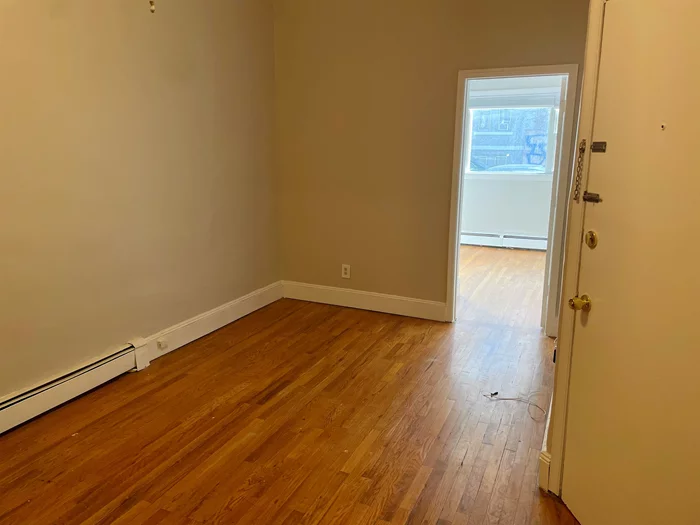 Located a few blocks from Path. 1 block to Church Sq. Park. First floor unit in small building. Hardwood floors throughout.  HUGE PRIVATE YARD!! Situated in the heart of Hoboken. Close to PATH, bus, lightrail, and ferry. 2 separate equal size bedrooms, perfect for share. Hardwood floors. Please call for a showing.