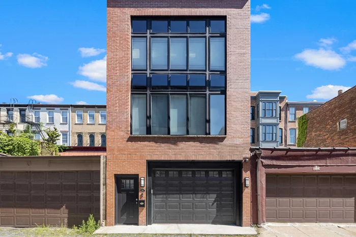 This bright and spacious lofted one-bedroom with an office nook is located on Hoboken's charming cobblestone Court Street. Enjoy a private entrance with a Ring doorbell, soaring 20' ceilings, and a striking wall of windows that fill the space with natural light. The home offers central air conditioning, a modern open kitchen fully equipped for your needs, and a 60 wall-mounted TV with Sonos surround sound. Conveniently located just a short walk from the PATH and Hoboken Terminal, and only one block from Washington Street's shopping, dining, and transit options, this loft combines comfort, style, and unbeatable accessibility.