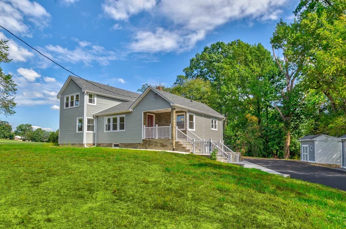 Beautifully renovated 4-bedroom, 3-bath home on 3/4 acre, zoned commercial and ideal for residential living! This unique property boasts a full modern kitchen plus a cold kitchen, two spacious living rooms, and a driveway that accommodates over 10 cars. Recently updated with new roofing, siding, windows, doors, flooring, electrical, plumbing, high-efficiency HVAC, a new city water line, and two septic tanks with alarm systems. EV charging is available. Conveniently located in an excellent school district, within walking distance to Marlboro Shopping Center, and with a new sidewalk planned by the city. Don't miss this opportunity! Make this unique property your home today!