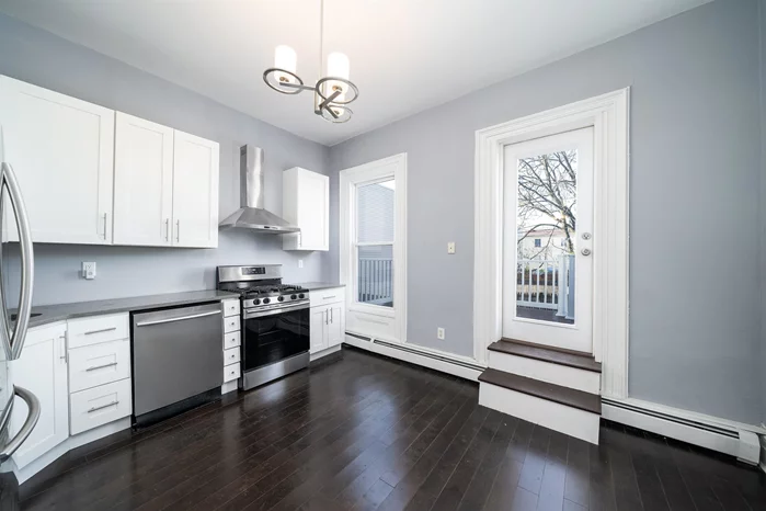 This completely renovated 2bedroom, 1 bathroom unit is located in the heart of booming Jersey City Heights with 1100 Sq ft of space. The Property features a parking space, deck off the kitchen, and use of the large backyard. The interior offers stainless steel kitchen appliances, hardwood floors, high ceilings, multiple closets for storage and modern finishes mixed with original historical character throughout. World Trade Center View from the bedroom.The property is conveniently located near NYC transportation, including the Journal Square PATH Station, Light Rail and NJ transit, and located next to a laundromat. Enjoy easy access to Hoboken, Journal Square and Downtown Jersey City restaurants, nightlife, parks, and entertainment.