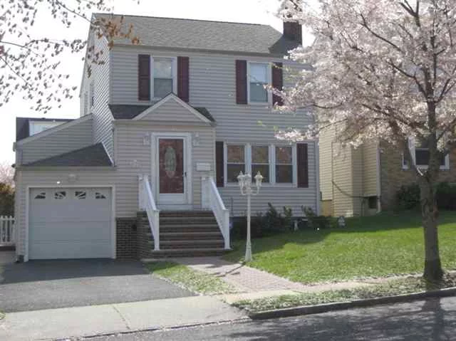 Location, location! Move in condition Colonial. This home features newer roof, siding, windows, furnace & electric service. Located on one of Belleville's finest streets. All good size rooms plus walk up finished 3rd floor & finished basement and above ground pool.