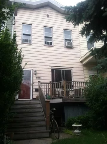 Great starter home on quiet tree-lined street with original skylights, hardwood floors, banisters, and stairs. Easy transportation to NYC. House zoned a 2 family.