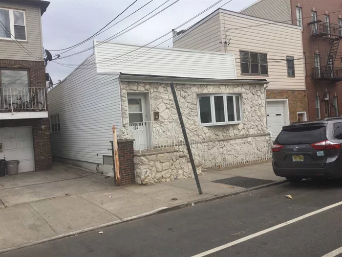 Well maintained, Move in Ready Single Family home in a quiet residential avenue of JC Heights. New Kitchen, Windows, Water Heater, Deck. Above ground Pool. Roof is in good condition, about 10 years old