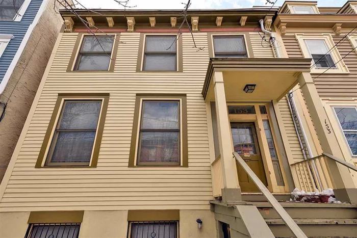 A beautiful piece of JC history. This historic row home is 25feet wide and roughly 2700sqft of total livable sqft. Currently used as a 1F where the downstairs is an office and studio, this can easy be converted back to a 2F with minor work to have income from the 1st floor with amole living space on the other floors for owner occupant. Original detail everywhere in this renovated home with C/AC and great outdoor space. Deed parking space available for an additional cost.