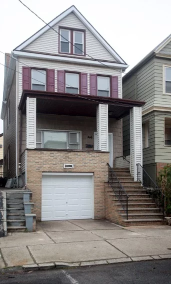 Large One Family in the Heart of Bayonne. Attached 2 car garage, stainless still appliances, under counter led lighting, hardwood floor throughout. Close to Light Rail.