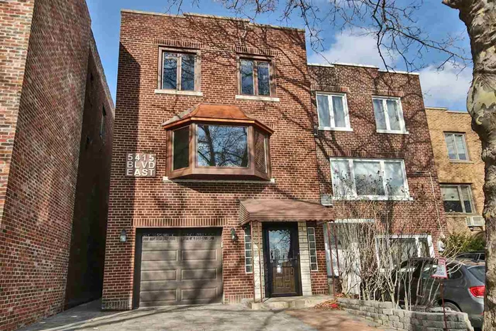 A unique single-family home on one of the most desirable streets in West New York, Boulevard East. This charming house is conveniently located across the street from the recently renovated Memorial Park between 54th and 60th street with unobstructed view of the midtown Manhattan skyline. This all-brick house was built in the 1950's and purchased from the original owning family. The house was recently fully painted and refurbished including: Efficient and elegant double-panel Anderson windows, including a 13 foot wide bay window overlooking Boulevard East and the Manhattan skyline. New kitchen with a granite top, center island and stainless steel appliances. The kitchen also features a bay window overlooking the charming backyard. Newly-paved driveway and a new elegant front door, giving this house a luxurious look and entrance. Newly stained and sealed oak flooring and five zones mini-split air conditioning system. This system offers efficient heating and cooling throughout the house. Save money in the summer and the winter by only heating or cooling the section of the house you are staying in. The house can also be heated with gas through the radiators in every room. Newly renovated roof, designed to effectively drain water and provide cooling of the attic in hot days using solar-powered fans. This newly redesigned open-layout single-family has 2400 Sqft of living space on a lot that is approximately 25x92 ft. Unlike most of the other houses on that block, this house is attached on one side and detached from other houses on the other side, giving it access to the backyard through an alley without the need to go through the house. The house features one spacious master bedroom with ample closet space and a hidden ceiling drop-down projection screen. Two additional smaller rooms; 1.5 bathrooms, a large laundry room with brand new stackable LG washer and dryer. Parking is a must in West New York, so this house offers an indoor garage that can fit two cars. Additionally, three more cars can be parked on the driveway and in the reserved sidewalk parking space. The backyard is very cozy with a seating area around a custom built stone gas fireplace under a cherry tree that is as high as the house. The cherry tree blooms in the spring and offers the tastiest cherries in the summer. Being only about 3 miles away from Times Square, the location of this house is ideal for NYC commuters, with more than a dozen buses stopping within a few yards from the house. The current owner invested more than $15, 000 in architectural design and permit requests in connection with an application for a variance with the city of West New York to get approval to add one more floor and expand the house into the backyard by an additional sixteen feet. The hearing for the variance is coming up shortly. When approved, the option to expend the house will significantly improve its value. Act now before it is too late.