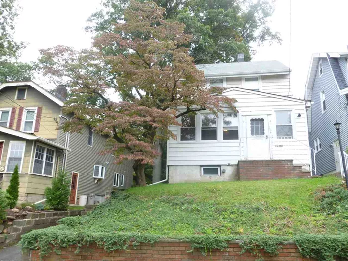 If you are looking for a project, this 2 BR Colonial is it! Located very close to schools, NY bus, center of town & Hackensack/Seton Hall Medical School. Windows were replaced, property size is 40 x 150 (irr). Most of the value is in the land. Decent square footage, forced hot air heat, heated front porch. Lots to start with to make this a lovely home! Sold strictly AS-IS condition. Side door inoperable. Buyer responsible for c/o and related expenses.