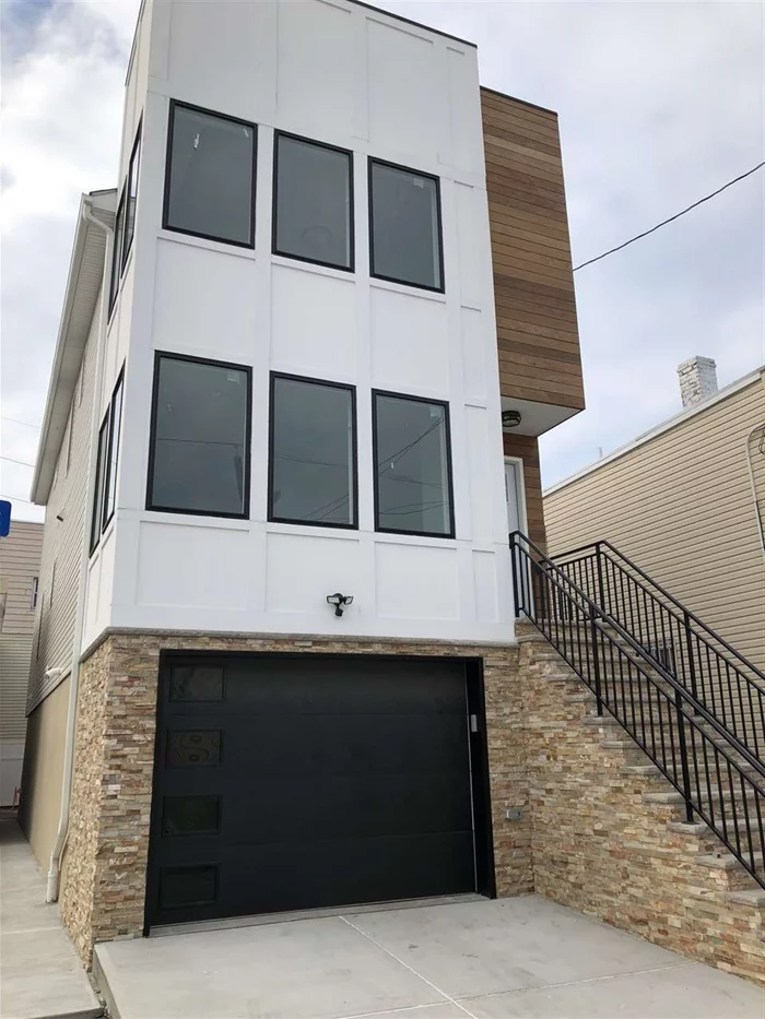 Gorgeous New Construction in North Bergen. 3 bedrooms, 2 full baths, 2 half baths, beautiful custom kitchen with wet bar, large windows all around, laundry room, oversized garage...too many great features to list! Call today to schedule a tour of this amazing one family home, walking distance from the Light Rail Station. Easy commute to NYC just minutes from the Lincoln Tunnel. Close to everything!