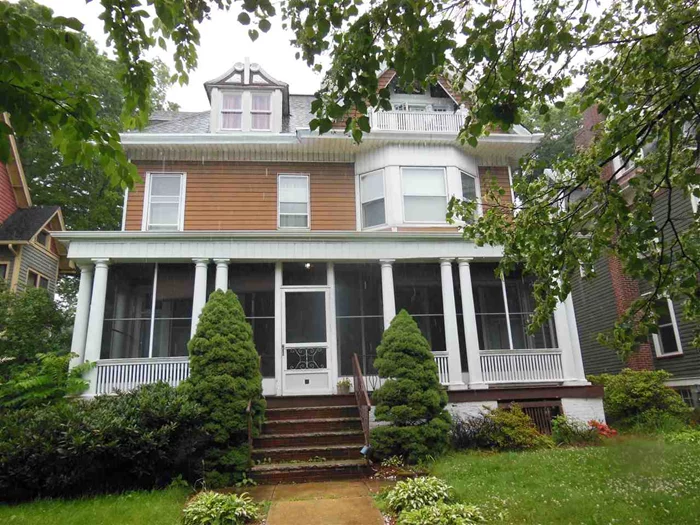 Fabulous Colonial charmer ready to make your own! Magnificent stained glass throughout. Well preserved original hardwood floors and antique woodwork throughout. Beautiful Corinthian columns in entry, wonderful staircase & welcoming screened porch. 6 beds, 2.5 baths, 3, 000 living Sq Ft with high ceilings! Near downtown and midtown direct train. Sold as is condition.