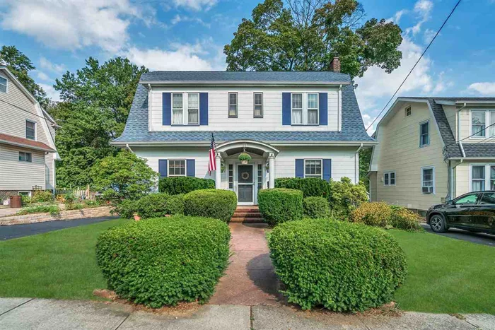 You'll love this stately 3 bedroom, 1.5 bath center hall colonial! The entrance foyer welcomes you into a spacious living room with wood-burning fireplace, French doors lead to a comfortable family room with a wall of windows offering a view of the lovely yard. There is a formal dining room, perfect for entertaining, with open flow to living room and kitchen with custom oak cabinets, stainless steel sink, double pantry, access to deck and a half bath. The 2nd level has 2 linen closets and built-ins in the hallway, master bedroom with 2 walk-in closets plus an additional closet, 2 additional bedrooms and a full bath. There is a full, finished basement with family room, wet bar, utility room and laundry. Beautiful hardwood floors, chestnut doors and moldings, security system, 2 car detached garage with loft. Conveniently located close to center of town, schools and NYC transportation.