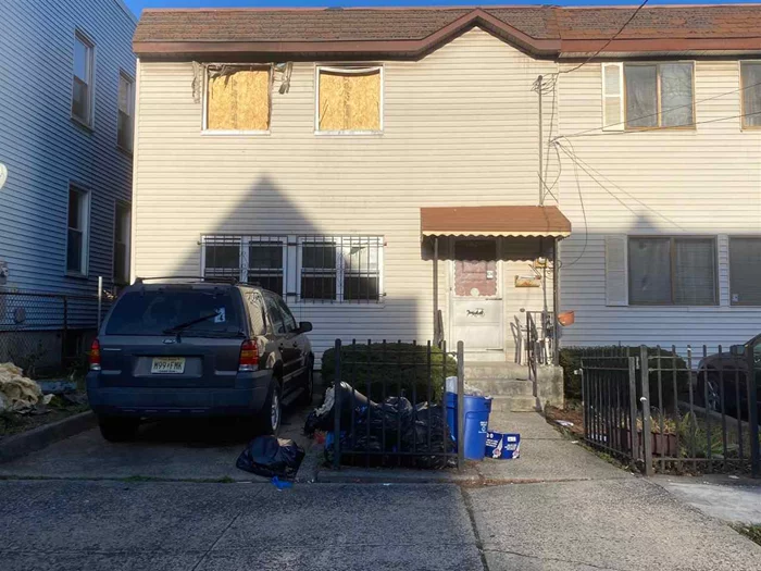 Investor special. Fire damaged property in the booming Bergen Lafayette section of Jersey City. Only a few minutes to MLK Drive Light Rail stop and close to Liberty State Park. 26.5 x 93.5 lot. The possibilities are endless. Being sold As Is and onl cash or 203k loan financing being considered.