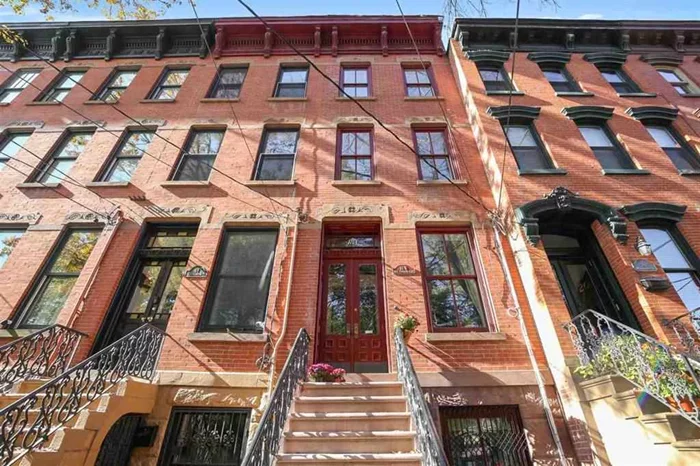This renovated jaw-dropping single family/brownstone in Downtown Jersey City in the sought-after neighborhood of iconic Hamilton Park boasts the perfect touch of old world charm, while providing plenty of modern amenities and contemporary finishes to surely delight. The garden level begins with a massive dining room, which features exposed brick walls and an expertly preserved fireplace mantel. Make your way to the nearby kitchen to find granite countertops, a gorgeous tile backsplash, and stainless steel appliances including, a refrigerator, gas range, and dishwasher. From here, you'll enjoy direct access to your private outdoor oasis/ backyard, perfect for hosting guests if you're not across the road at Hamilton Park! As you venture upwards you will find the expansive living room, which boasts large windows that allow for plenty of natural sunlight to illuminate the glossy hardwood floors. Continue through detailed archways to find a separate family room, which features yet another decorative fireplace mantel. Then take a short walk up the stairs to the 2nd floor where you find 2 huges bedrooms along with a full bathroom. The master bedroom of this delightful Jersey City home comes outfitted with a private en-suite, a truly massive walk-in closet and a home office. You'll find this architectural masterpiece is dripping with luxuries, including Calcutta gold marble countertops, opulent wall fabrics, fabulous window treatments, original woodwork and a, 500-square-foot basement for laundry and storage. Conveniently located directly on Hamilton Park, and just 1-mile from the Holland Tunnel into NYC makes this a commuter dream!